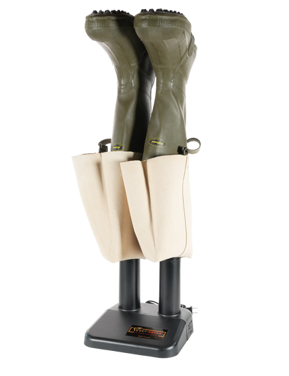A pair of olive green wader boots inserted onto a black boot dryer shown against a plain white background.